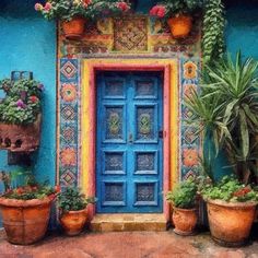 a blue door with potted plants in front of it