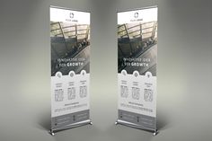 two roll up banners with an image of people on the escalator and below them