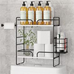 a bathroom shelf with soap, lotion and toiletries on it in front of a marble wall