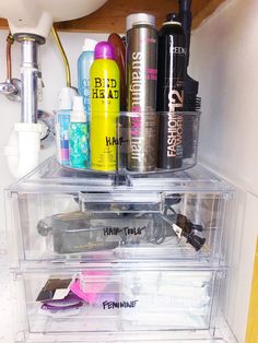 the inside of a refrigerator filled with lots of different types of hair products and other items