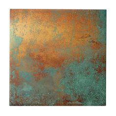 an old rusty metal plate with rust on the side and green, orange and yellow paint