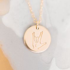 Our 'I Love You' Disc Necklace expresses the universal sentiment in sign language. Crafted in high quality 14k Gold Fill or Sterling Silver, this beautiful necklace is hypoallergenic and waterproof so it can be worn every day. Show someone special how much you care. • All necklace components are Sterling Silver or 14k Gold Filled (including jump rings). No plating.• 100% hypoallergenic, waterproof and tarnish resistant• All orders include one (1) complimentary polishing cloth to help you keep your items looking shiny and new! If you need more than one, please visit this listing: Polishing Cloth. I Love You Signs, Hypoallergenic Necklace, Rose Gold Gifts, Stamped Necklaces, Lace Jewelry, In Sign, Necklace Box, Disc Necklace, Rose Gold Metal