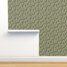 an empty room with a wallpaper pattern on the wall and a wooden floor in front of it