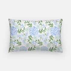 a blue and green floral pillow on a white background with an image of flowers in the middle