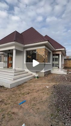 a house being built on the side of a road