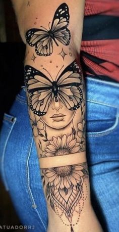 a woman's arm with butterflies and flowers on the side of her body,