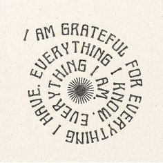 the words are written in blue ink on a white paper with a circular design that reads, i am grateful everything is for everyone else