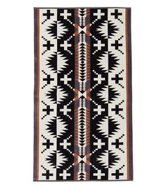 a black and white rug with geometric designs