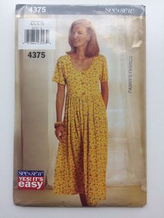 a woman's dress sewing pattern with short sleeves