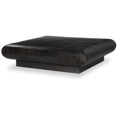 a black leather ottoman sitting on top of a white floor