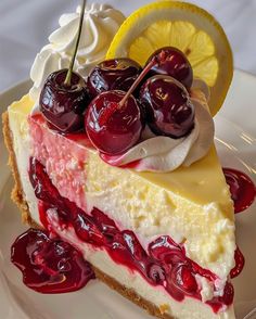 a slice of cheesecake with cherries and whipped cream