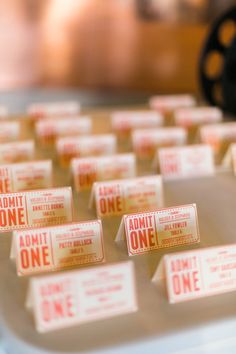 small tickets sitting on top of a table