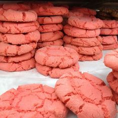 pink cookies are stacked on top of each other