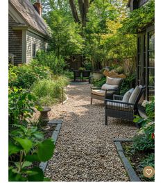 an outdoor patio area with gravel and rocks on the ground, surrounded by greenery