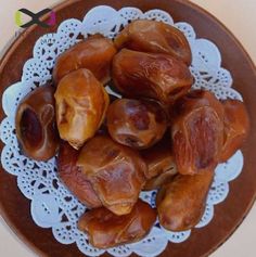 dates on a doily in a bowl with the words xoxi above it