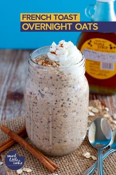 french toast overnight oats in a mason jar with cinnamon sticks and spoons next to it