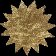 a gold star shaped decoration on a white background