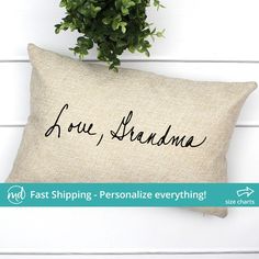 a pillow that says, i love grandma on it with a plant in the corner