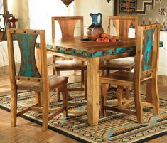 a dining room table with chairs and vases on top of it in front of a rug