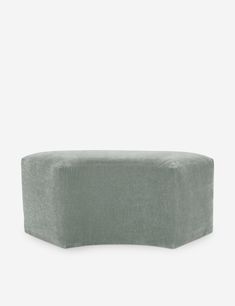 the back of a grey couch on a white background