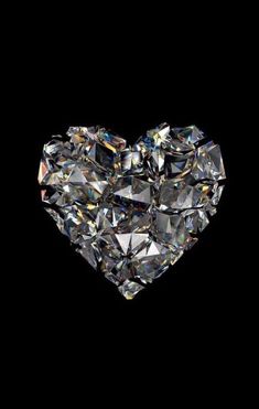 a heart shaped diamond on a black background