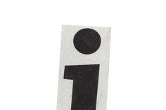 a white and black sign with the number one on it's side, in front of a white background