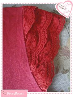 three pieces of red lace sitting on top of a pink cloth covered in flowers and hearts