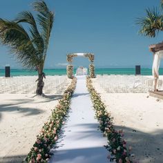 an outdoor ceremony set up on the beach