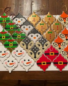 many decorated christmas cookies on a table