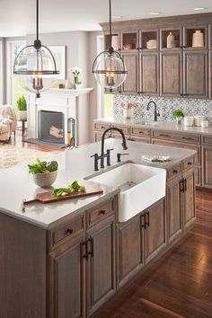 a large kitchen with wooden cabinets and white counter tops