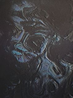 an abstract painting with black and blue colors on it's surface, in the dark