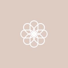 a white flower on a beige background with the word's name below it,