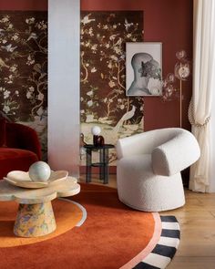 a living room filled with furniture and walls covered in wallpapered art nouveau designs