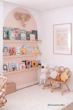 a baby's room with bookshelves and toys on the shelves in it