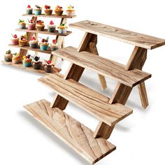 three wooden shelves with cupcakes on them