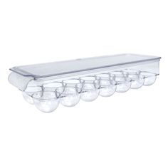 a clear plastic container with eight light bulbs hanging from it's side, on a white background