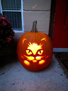 a carved pumpkin with a cat's face on it