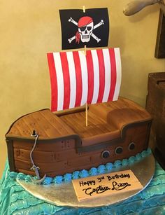 a birthday cake made to look like a pirate ship