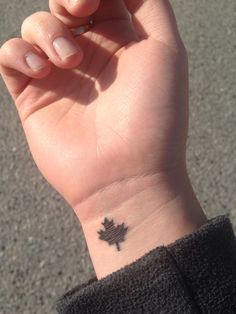 a person with a small tattoo on their wrist