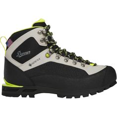 a pair of black and white hiking boots with yellow laces on the outstep