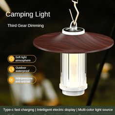 an image of a light that is on top of a table with the words, camping light third gear dimming