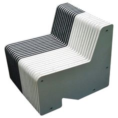 a white and black chair sitting on top of each other