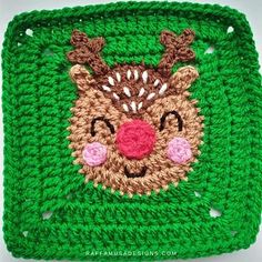 a crocheted square with a reindeer face on it