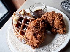 two fried chicken and waffles on a plate