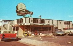 cars are parked in front of a restaurant