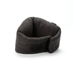 a gray dog bed on a white background