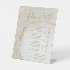 a white and gold price list card on a stand with the words, price list