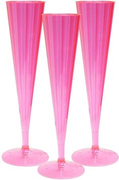 three tall pink vases sitting on top of each other