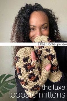 a woman is smiling and holding up her hand knitted mitts with the text, the luxe leopard mittens