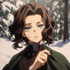 a woman with green eyes standing in the snow